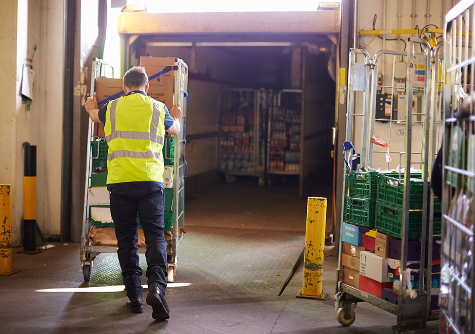 Worker pushing boxes